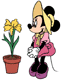 Minnie admiring a potted yellow orchid