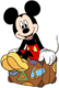 Mickey Mouse sitting on a suitcase