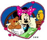 Minnie cuddling a teddy bear in bed