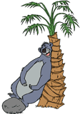 Baloo scratching his back on a tree