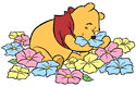 Winnie the Pooh smelling flowers