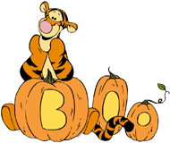 Tigger leaning on carved pumpkins