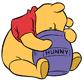 Winnie sticking head in honey pot
