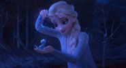 Elsa sprinkling snowflakes over the salamander Bruni